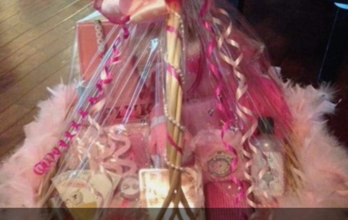 pink fluffy basket with bath products