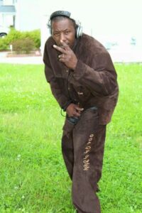 dj wearing brown jacket and pants 4